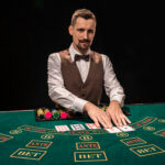 croupier gambling table casino black background concept victory